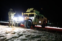 Soldiers from 113th Military Police Company, Mississippi Army National Guard, patrol the missile defense complex as part of exercise Guardian Watch 23 at Fort Greely, Alaska, Nov. 2, 2022. Guardian Watch 23 focused on conducting ground-based midcourse defense and critical installations security, which are the two missions of the 49th Missile Defense Battalion. (Alaska National Guard photo by Staff Sgt. Katie Mazos-Vega)