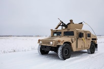 Spc. Christopher Mosen, a military policeman with 113th Military Police Company, Mississippi Army National Guard pulls security on a patrol around the missile defense complex during Exercise Guardian Watch 23 at Fort Greely, Alaska, Oct. 31, 2022. Guardian Watch 23 focused on conducting ground-based midcourse defense and critical installations security, which are the two missions of the 49th Missile Defense Battalion. (Alaska National Guard photo by Staff Sgt. Katie Mazos-Vega)