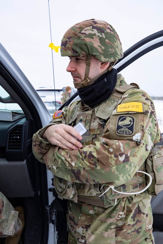 Spc. Devin Greenway, a military police Soldier with Company A, 49th Missile Defense Battalion, waits with an injured passenger during a simulated vehicle accident during Exercise Guardian Watch 23 held at Fort Greely, Alaska, Oct. 31, 2022. Guardian Watch 23 focused on conducting ground-based midcourse defense and critical installations security, which are the two missions of the 49th Missile Defense Battalion. (Alaska National Guard photo by Staff Sgt. Katie Mazos-Vega)