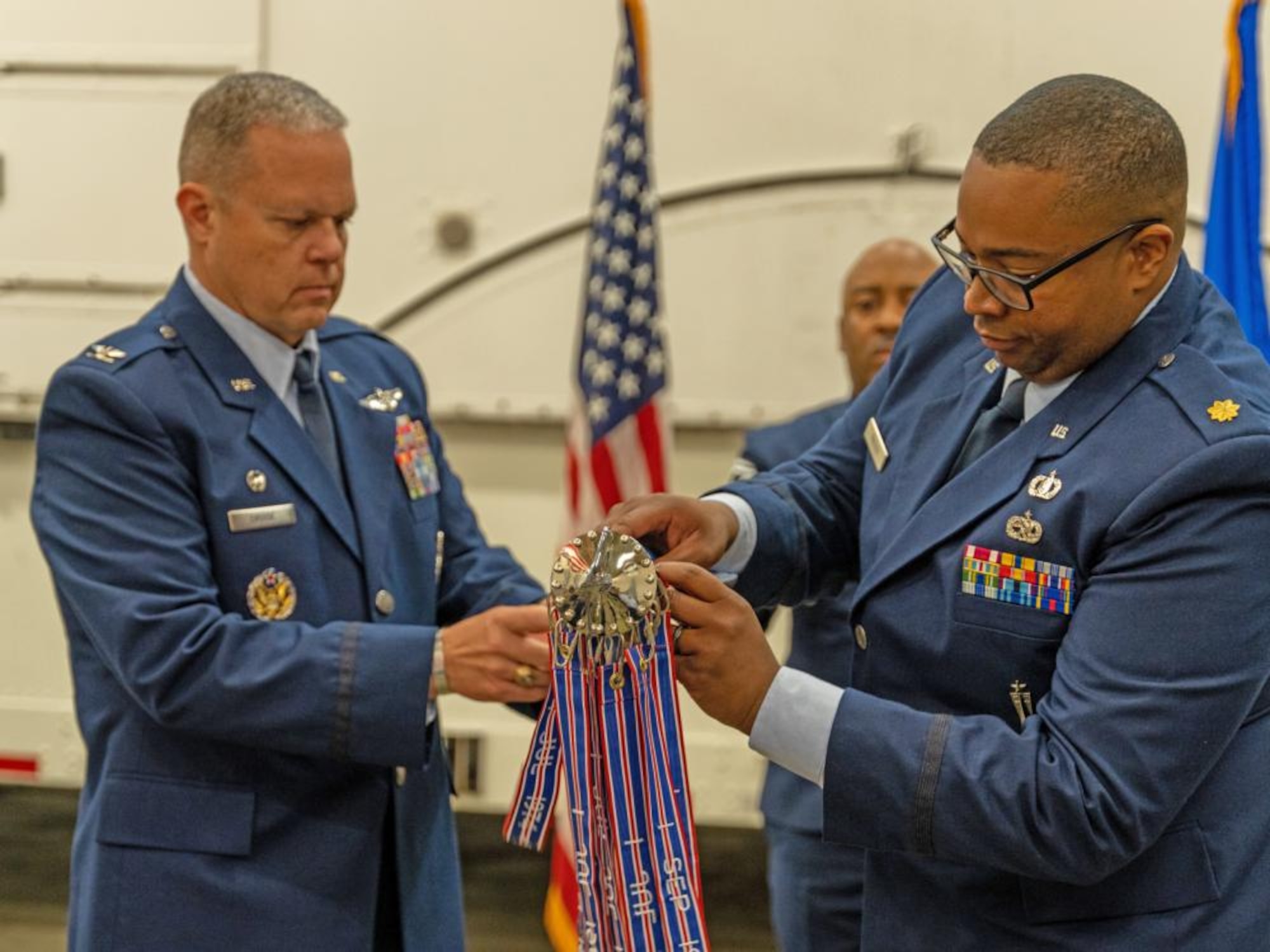 Col. Christopher Cruise (left), 377th Test and Evaluation Group commander, and Maj. Charles Frazier (right), incoming commander 377th Flight Test Missile Maintenance Squadron, uncase the 377 FTMMXS guidon prior to the stand-up ceremony of the unit on November 8, 2022 at Vandenberg Space Force Base, California. (Photo by MSgt Guy McCutcheon, 576 FLTS)