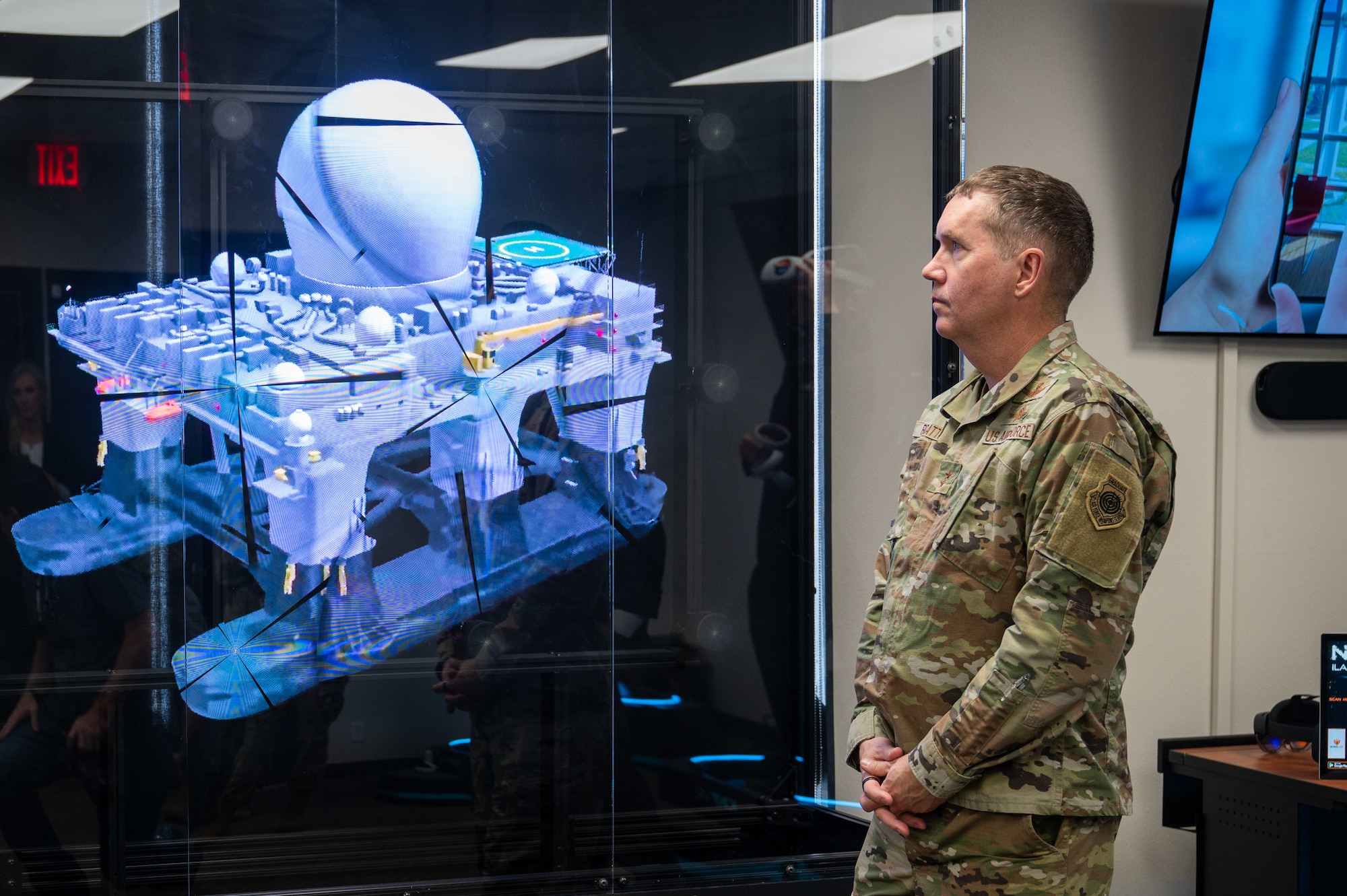 Maj. Gen. Shawn Bratton, Commander of Space Training and Readiness Command, observes a demonstration of a holographic device inside the 'Innovation Lab' at the National Security Space Institute - West campus, Colorado Springs, Colo., Nov. 8, 2022.