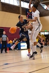 U.S. Navy Petty Officer 1st Class Christie Ayers, a member of team Navy, passes the ball during a game at the 2022 Armed Force's Men's and Women's basketball championships held at the Admiral Prout Fieldhouse on Naval Base San Diego, California Nov. 7, 2022. Service members from the U.S. Army, Marine Corps, Navy (with Coast Guard players) and Air Force (with Space Force players) battle it out for the gold. (U.S. Air Force photo by Staff Sergeant James R. Crow)