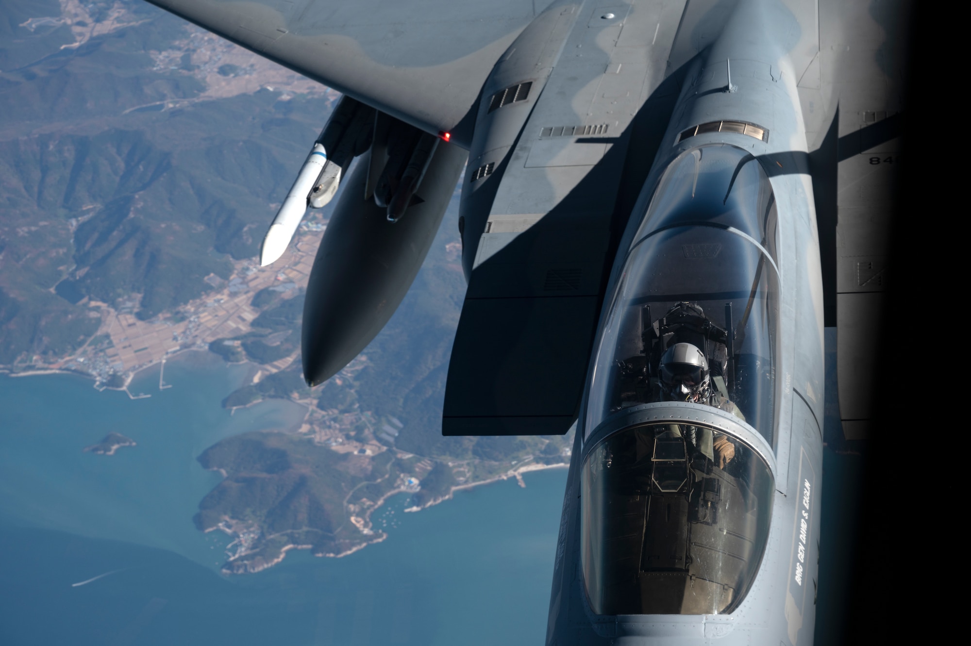 A U.S. Air Force 44th Fighter Squadron F-15C Eagle receives fuel from a 909th Air Refueling Squadron KC-135 Stratotanker over South Korea, Nov. 4, 2022. The Eagle's air superiority was achieved through a mixture of unprecedented maneuverability and acceleration, range, weapons and avionics. (U.S. Air Force photo by Senior Airman Jessi Roth)