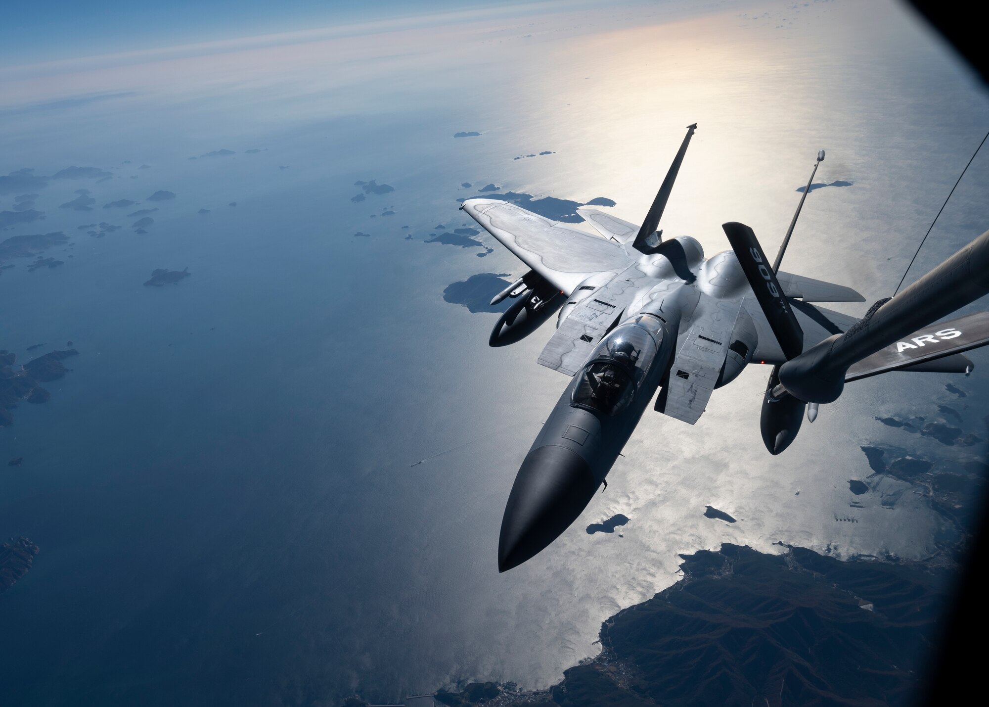 A U.S. Air Force 44th Fighter Squadron F-15C Eagle approaches a 909th Air Refueling Squadron KC-135 Stratotanker to conduct aerial refueling over South Korea, Nov. 4, 2022. Kadena's F-15's  were the first operational Eagles outfitted with an active electronically-scanned array radar, and the Legion Pod, the first infrared search-and-track system compatible with the aircraft. (U.S. Air Force photo by Senior Airman Jessi Roth)