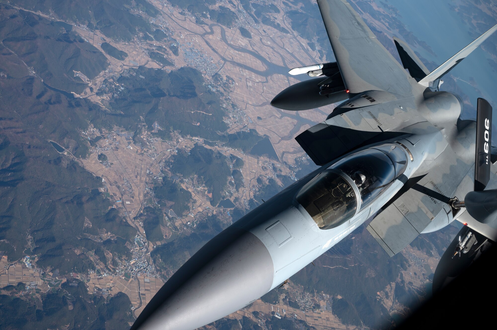 A U.S. Air Force 44th Fighter Squadron F-15C Eagle receives fuel from a 909th Air Refueling Squadron KC-135 Stratotanker over South Korea, Nov. 4, 2022. Kadena received its first F-15 C's in 1979. Since then, the tactical fighter has provided unmatched air superiority for the Indo-Pacific region. (U.S. Air Force photo by Senior Airman Jessi Roth)