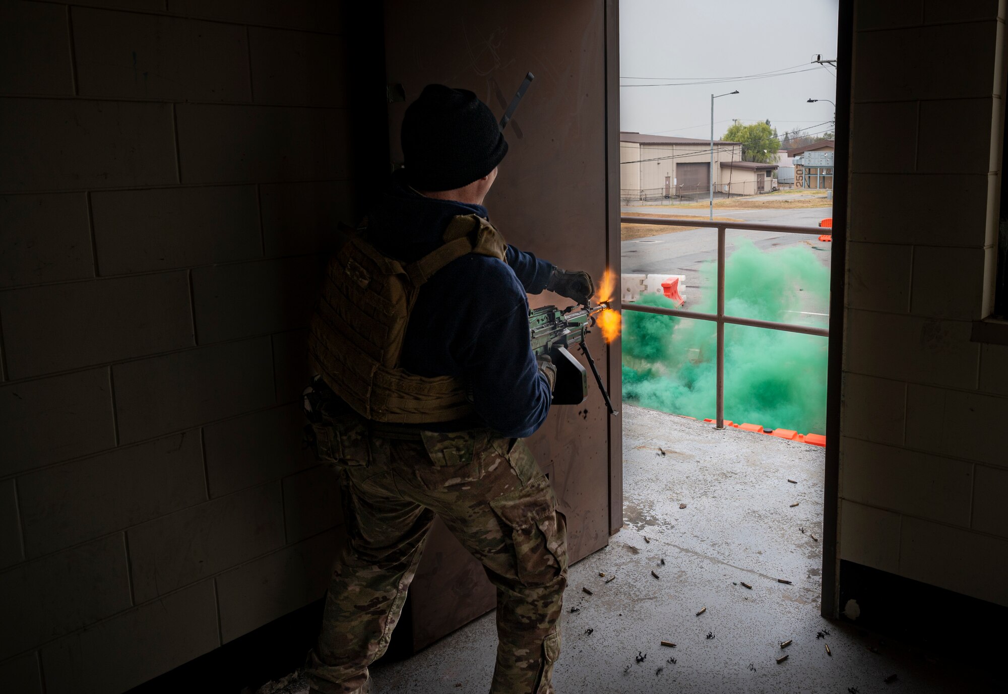 U.S. Air Force Staff Sgt. William McLaughlin, 51st Security Forces Squadron (SFS) combat arms instructor, fires blanks from a M240 machine gun during a joint Combat Readiness Course (CRC) with Republic of Korea Military Policemen at Osan Air Base, ROK, Nov. 3, 2022.