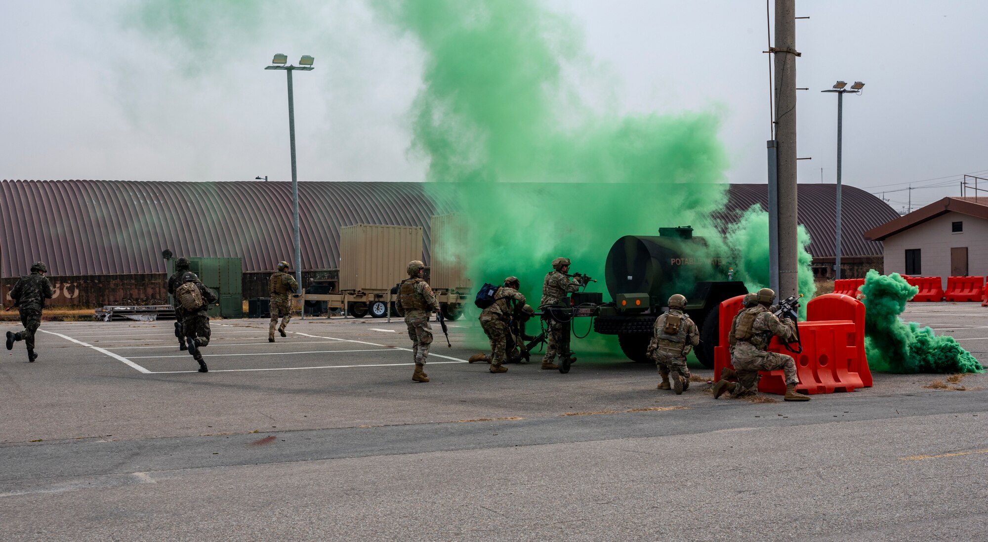 U.S. Air Force 51st Security Forces Squadron Defenders and Republic of Korea Military Policemen respond to a simulated base attack during a joint Combat Readiness Course at Osan Air Base, ROK, Nov. 3, 2022.