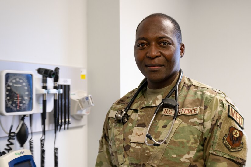 An airman poses for a photo.