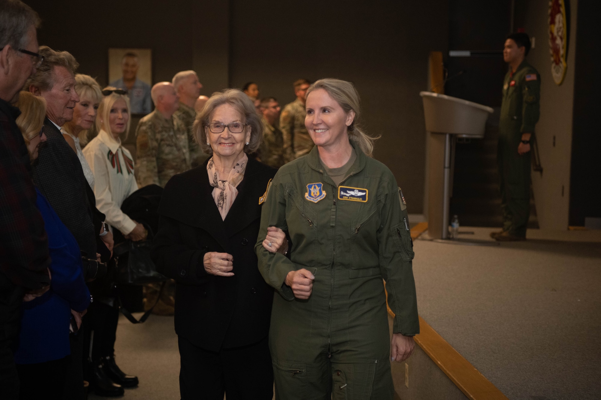 Lt. Col Gina Stramaglio walks with her grandmother, Alice Miller, during an assumption of command ceremony at Gus Grissom Hall, Oct. 16, 2022.