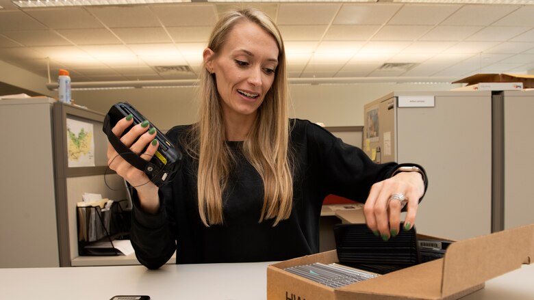 Pamela King, Logistics Management Office general supply specialist, is the U.S. Army Corps of Engineers Nashville District Employee of the Month for August 2022. She is seen here scanning old cell phones for turn in Nov. 8, 2022, at the district headquarters in Nashville, Tennessee. (USACE Photo by Lee Roberts)