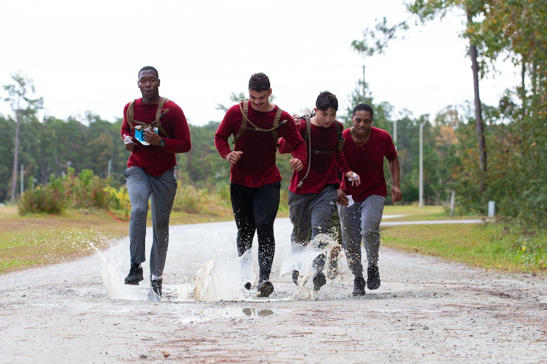 U.S. Marines assigned to Marine Corps Air Station (MCAS) Cherry Point race to the finish at Devil Dog Dare during the 25th Annual All-Terrain Unit Competition, MCAS Cherry Point, North Carolina, Oct. 28, 2022. Participants completed five physically demanding challenges over a seven-mile course. The competition allowed various units to build comradery while boosting morale. (U.S. Marine Corps photo by Cpl. Symira Bostic)