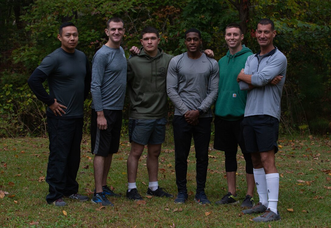 A team of U.S. Marines, assigned to Marine Aviation Logistic Squadron 14, Marine Aircraft Group 14, 2d Marine Aircraft Wing, called “Power Plant #1”, pose for a photo after their win at Devil Dog Dare during the 25th Annual All-Terrain Unit Competition, Marine Corps Air Station Cherry Point, North Carolina, Oct. 28, 2022. Participants had to complete five physically demanding challenges over a seven-mile course. The competition allowed various units to build comradery while boosting morale. (U.S. Marine Corps photo by Lance Cpl. Jade Farrington)