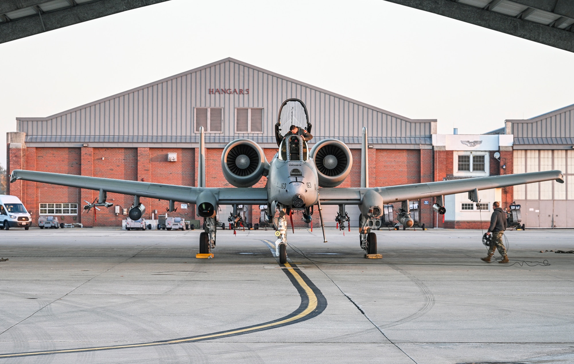 pilot walks toward a-10 aircraft