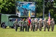 U.S. and Colombian Army Soldiers render salutes during the opening ceremony of Exercise Southern Vanguard