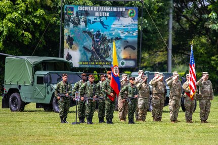 U.S. and Colombian Army Soldiers render salutes during the opening ceremony of Exercise Southern Vanguard