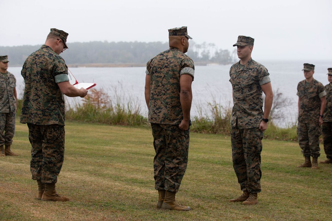 U.S. Marine Corps Sgt. Jeremy Moore, an aviation ordnance magazine division chief with Headquarters and Headquarters Squadron (H&HS), prepares to recite the oath for enlistment during a reenlistment ceremony at the Sound of Freedom Golf Course on Marine Corps Air Station Cherry Point, North Carolina, Oct. 25, 2022. Moore signed for an additional four years, marking this his second reenlistment towards his goal of serving 20 years. (U.S. Marine Corps photo by Cpl. Symira Bostic)