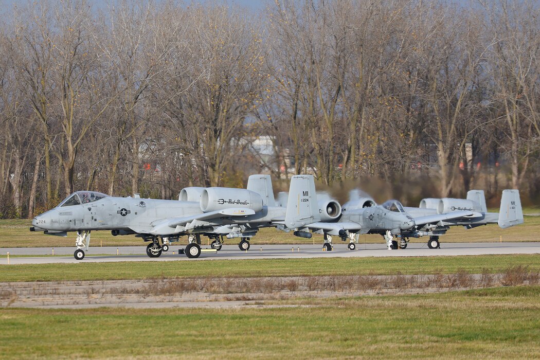 Three A-10s on a runway