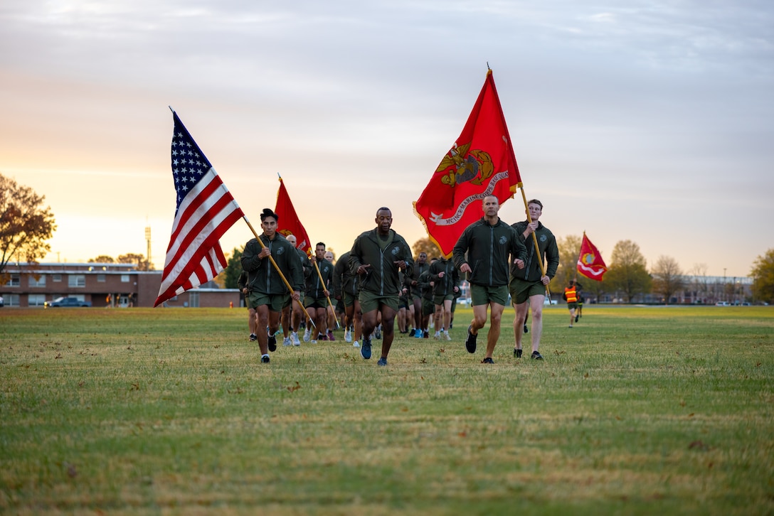 U.S. Marine Corps Col. Michael L. Brooks, base commander, Marine Corps Base Quantico, center, and Sgt. Maj. Collin D. Barry, sergeant major, Marine Corps Base Quantico, right, lead Marines during a motivational run honoring the Marine Corps’ 247th birthday on Marine Corps Base Quantico, Virginia, Nov. 10, 2022. Each year, Marines come together to celebrate the birthday with ceremonies that recall the history of the Corps and enhance the camaraderie shared across generations of Marines. (U.S. Marine Corps photo by Lance Cpl. Joaquin Dela Torre)