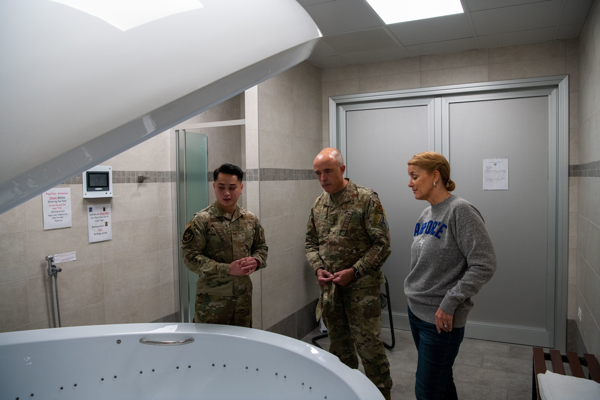 U.S. Air Force Lt. Gen. Robert Miller, Surgeon General of the Air Force, and Chief Master Sgt. Dawn Kolczynski, Medical Enlisted Force and Enlisted Corps Chief, visit the Cobra Clinic at Aviano Air Base, Italy, Nov. 9, 2022. The sensory deprivation tank at the clinic, is a dark, soundproof tank with a foot or less of salt where users float for therapeutic effects, both mental and physical. (U.S. Air Force photo by Airman 1st Class Thomas Calopedis)