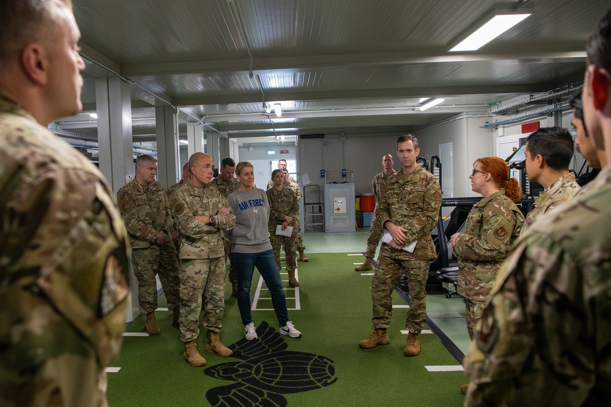 U.S. Air Force Lt. Gen. Robert Miller, Surgeon General of the Air Force, and Chief Master Sgt. Dawn Kolczynski, Medical Enlisted Force and Enlisted Corps Chief, visit the 56th Rescue Squadron (RQS) at Aviano Air Base, Italy, Nov. 9, 2022. The 56th RQS medical team brief Miller and Kolczynski on how their approach to physical and mental wellness and how they optimize pararescuemen’s health. (U.S. Air Force photo by Airman 1st Class Thomas Calopedis)
