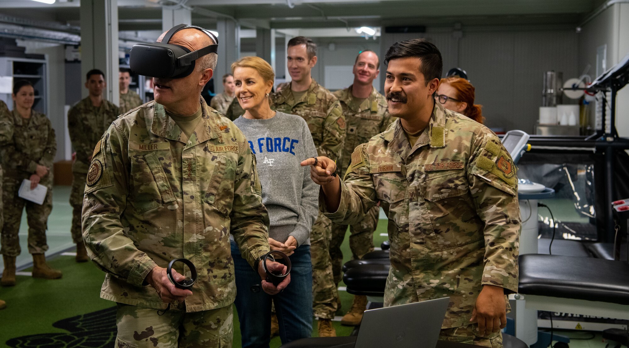 U.S. Air Force Lt. Gen. Robert Miller, Surgeon General of the Air Force, and Chief Master Sgt. Dawn Kolczynski, Medical Enlisted Force and Enlisted Corps Chief, visit the 56th Rescue Squadron (RQS) at Aviano Air Base, Italy, Nov. 9, 2022. The 56th RQS incorporates virtual reality into their pararescuemen’s training to present them with unique obstacles they must find solutions to all while in the squadron. (U.S. Air Force photo by Airman 1st Class Thomas Calopedis)