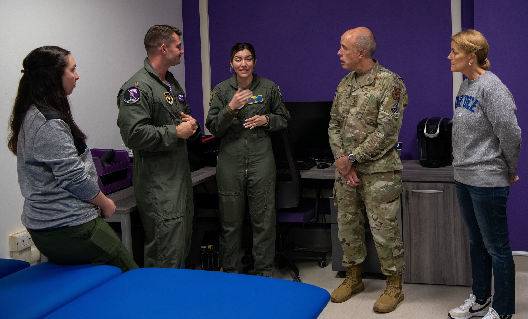 U.S. Air Force Lt. Gen. Robert Miller, Surgeon General of the Air Force, and Chief Master Sgt. Dawn Kolczynski, Medical Enlisted Force and Enlisted Corps Chief, visit the 510th Fighter Squadron (FS) at Aviano Air Base, Italy, Nov. 9, 2022. The 510th FS recently completed a room where physicians assigned to the squadron treat pilots for heath conditions, increasing their health, longevity and performance. (U.S. Air Force photo by Airman 1st Class Thomas Calopedis)