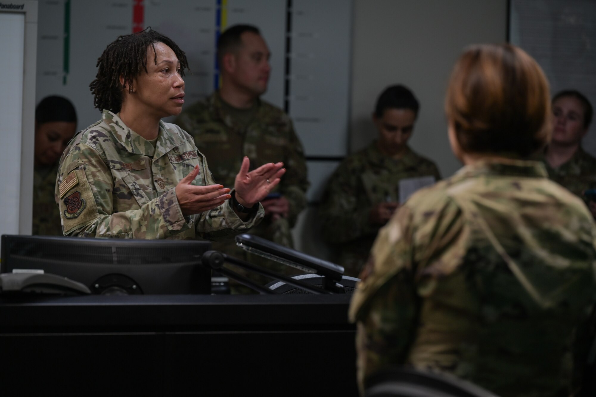 Chief Master Sgt. Sheronne King, 15th Wing command chief, speaks to Chief Master Sgt. of the Air Force JoAnne S. Bass in an Emergency Operations Center during a base visit to Joint Base Pearl Harbor-Hickam, Hawaii, Nov. 7, 2022. King highlighted the 15th Medical Group and 15th Comptroller Squadrons’ ability to provide medical and financial support to families affected by the recent JBPH-H water-related incidents. (U.S. Air Force photo by Staff Sgt. Alan Ricker)