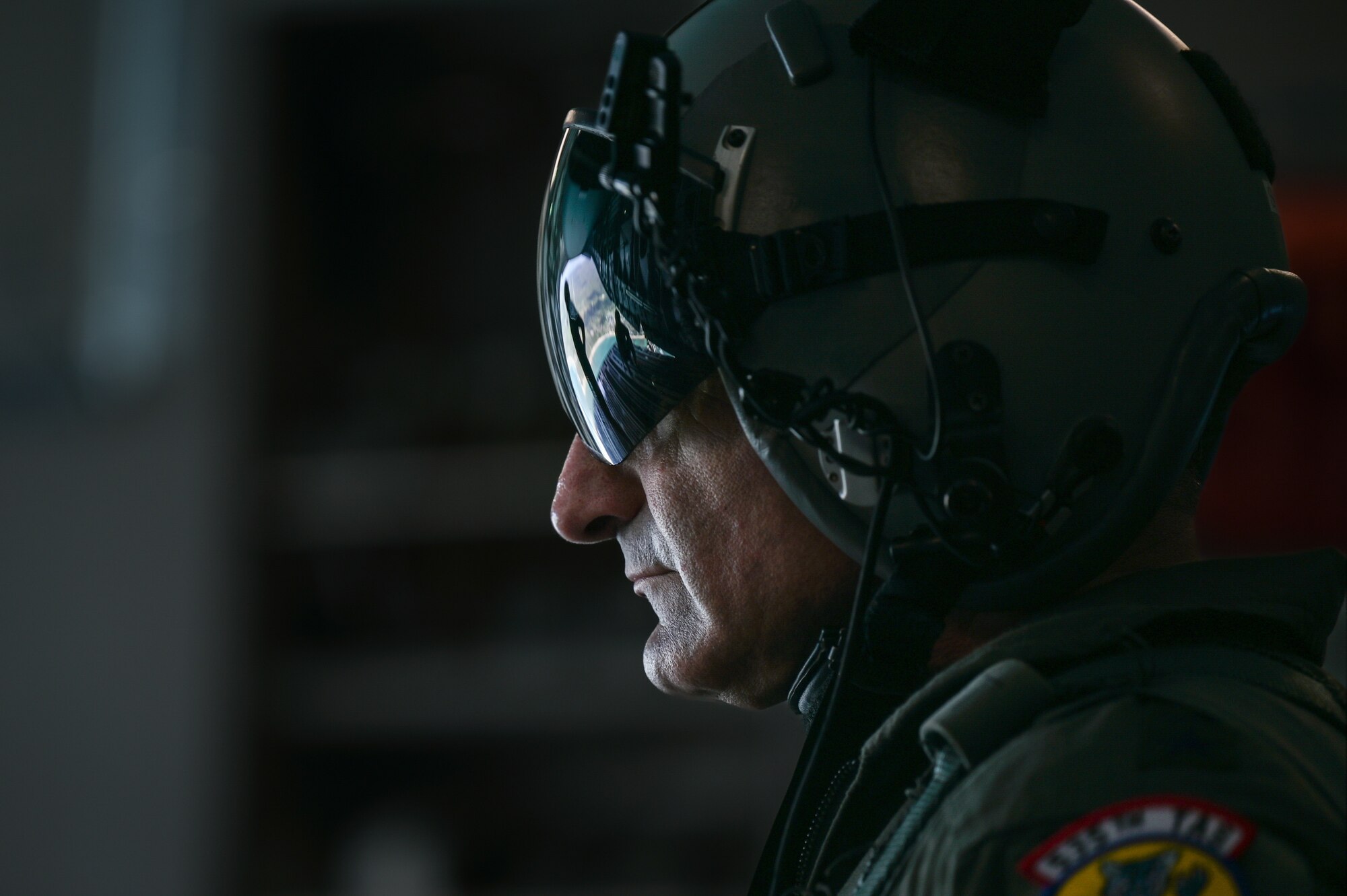 U.S. Air Force Lt. Gen. David Nahom, commander of Alaskan NORAD Region, Alaskan Command and 11th Air Force, views the Pacific Ocean from the ramp of a C-17 Globemaster III while flying above the Hawaiian Islands as part of a 15th Wing immersion tour Oct. 24, 2022. The two-hour familiarization flight provided the aircrew an opportunity to share an overview of the squadron’s mission and demonstrate the capabilities of the cargo aircraft. (U.S. Air Force photo by Staff Sgt. Alan Ricker)