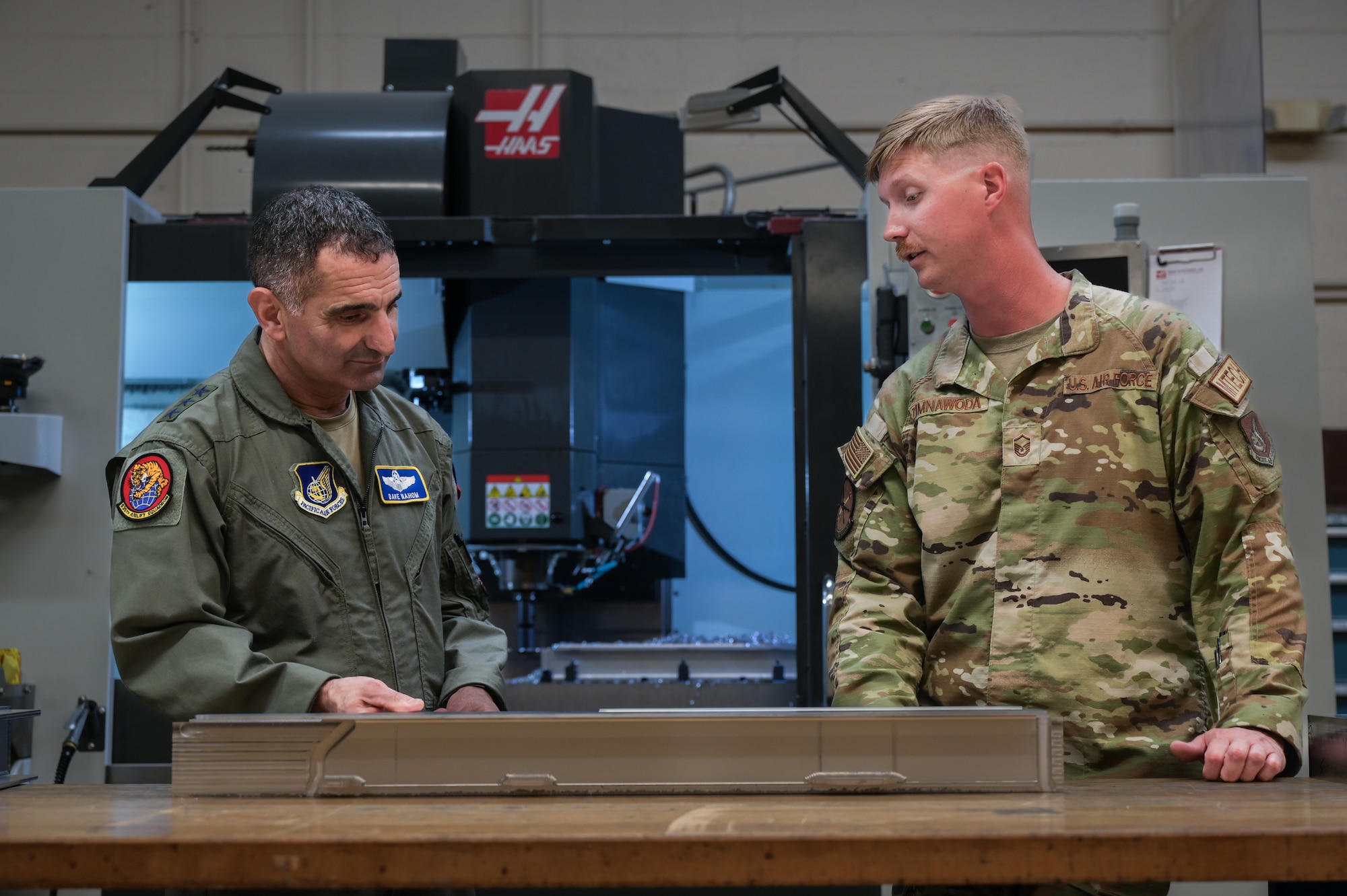 U.S. Air Force Master Sgt. Alexander Zimnawoda, 15th Maintenance Squadron aircraft metals technology non-commissioned officer-in-charge, displays a C-17 Globemaster III structure that was fabricated in-house to U.S. Air Force Lt. Gen. David Nahom, commander of Alaskan NORAD Region, Alaskan Command and 11th Air Force, during a 15th Wing immersion tour on Joint Base Pearl Harbor-Hickam, Hawaii, Oct. 24, 2022. During the maintenance tour, Nahom was briefed on the maintenance total force integration relationships and the 15th Maintenance Group’s mission and capabilities. (U.S. Air Force photo by Staff Sgt. Alan Ricker)