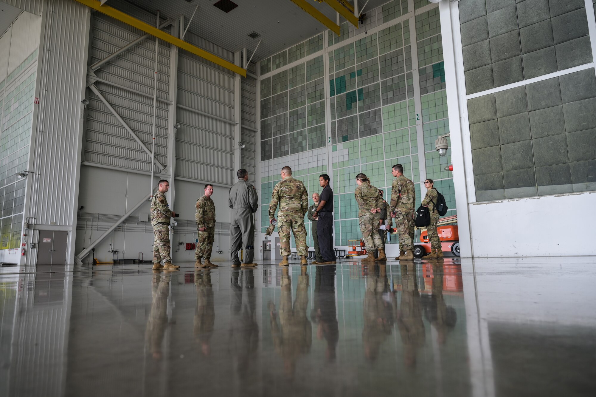 Personnel assigned to the 15th Aircraft Maintenance Squadron aircraft structural maintenance flight brief U.S. Air Force Lt. Gen. David Nahom, commander of Alaskan NORAD Region, on the single-bay corrosion control hangar during a 15th Wing immersion tour on Joint Base Pearl Harbor-Hickam, Hawaii, Oct. 24, 2022. During the maintenance tour, Nahom was briefed on the maintenance total force integration relationships and the 15th Maintenance Group’s mission and capabilities. (U.S. Air Force photo by Staff Sgt. Alan Ricker)