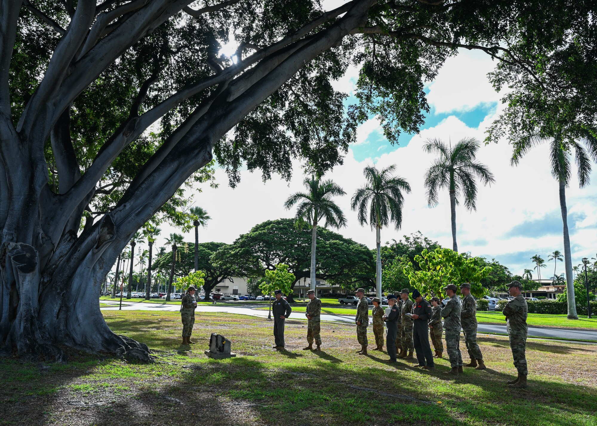 U.S. Air Force Master Sgt. Merri Fain, 15th Operational Medical Readiness Squadron mental health flight chief, briefs U.S. Air Force Lt. Gen. David Nahom, commander of Alaskan NORAD Region, Alaskan Command and 11th Air Force, during an immersion tour at Joint Base Pearl Harbor-Hickam, Hawaii, Oct. 28, 2022. Fain provided accounts of the 15th Medical Group’s history and the significance of numerous events. (U.S. Air Force photo by Senior Airman Zoie Cox)