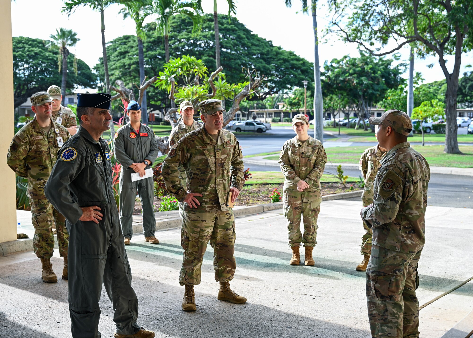 U.S. Air Force Lt. Gen. David Nahom, commander of Alaskan NORAD Region, Alaskan Command and 11th Air Force, and U.S. Air Force Chief Master Sgt. Kristopher Berg, 11th Air Force Command Chief are briefed on the history behind the name of the 15th Medical Group building during an immersion tour at Joint Base Pearl Harbor-Hickam, Hawaii, Oct. 28, 2022. U.S. Air Force Tech. Sgt. Paul Ebiya, 15th Healthcare Operations Squadron outpatient pharmacy non-commissioned officer-in-charge, shares the story of Army Air Corps 1st Lt. William Schick, recounting the selflessness and bravery shown in the Dec. 7, 1941, attack on Pearl Harbor. Schick allowed more critical patients to be treated before him, eventually succumbing to his injuries and being the first doctor killed in WWII. (U.S. Air Force photo by Senior Airman Zoie Cox)