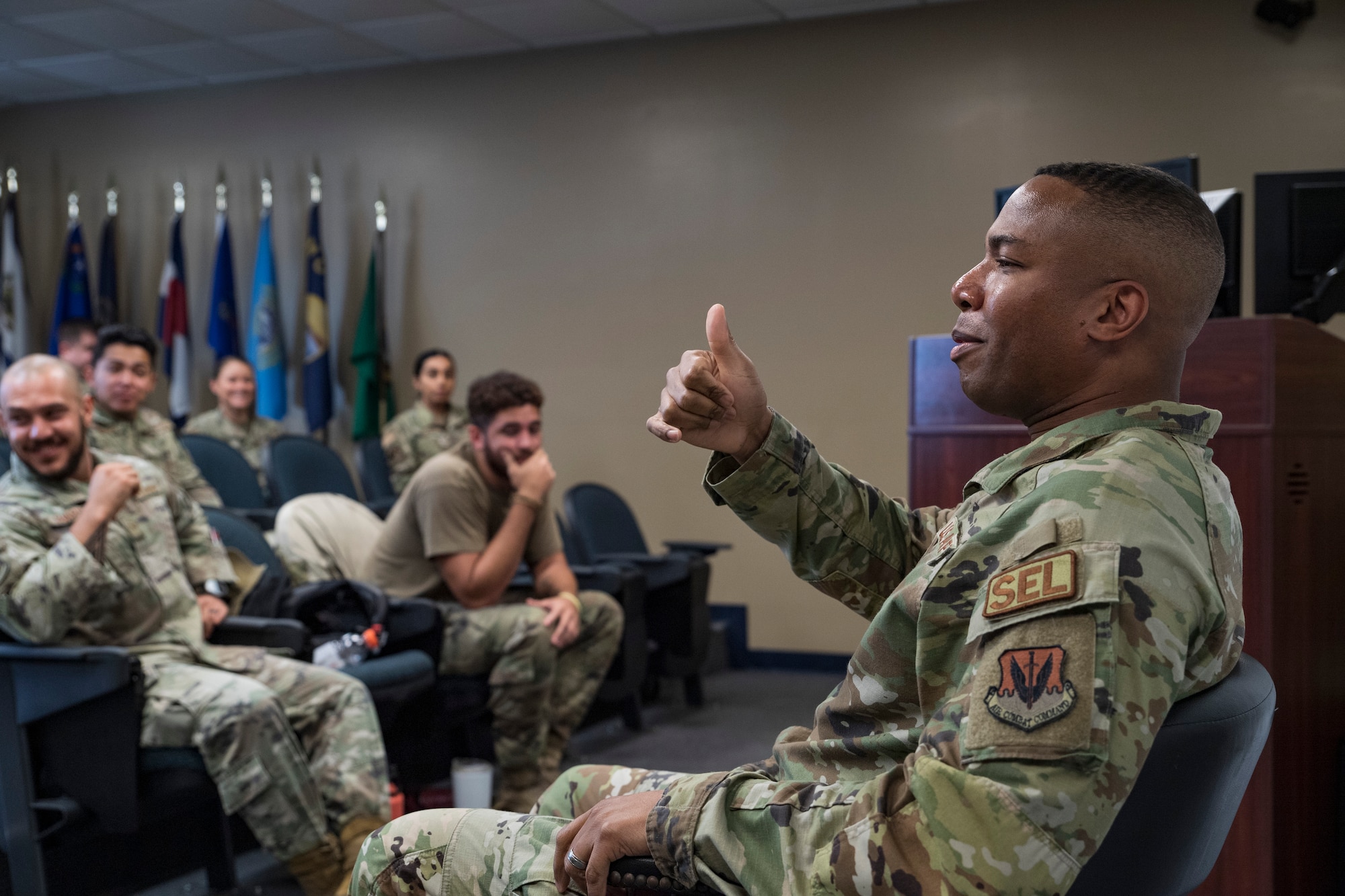 A photo of an airmen giving a thumbs up.