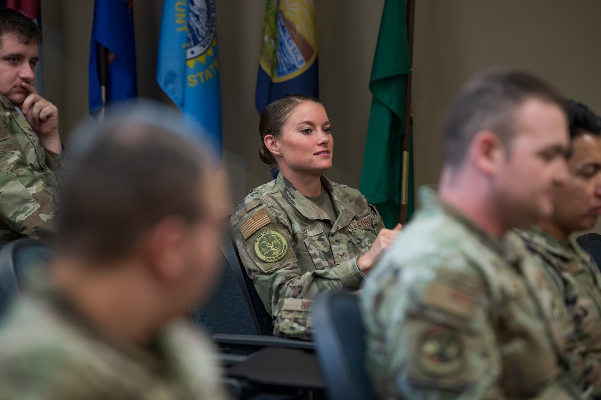 A photo of an Airman sitting at a desk