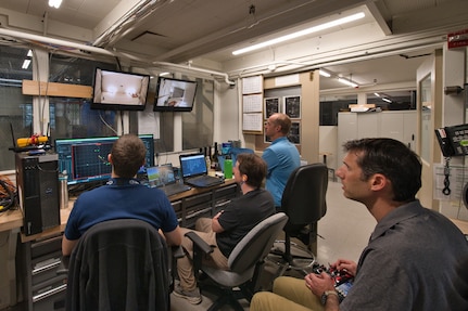 From left: Aerospace Engineer Dr. Jared Soltis, Naval Information Warfare Center Pacific employees Fred Birchmore and Dr. Kurt Talke, and Aerospace Engineer Eric Silberg conduct drone tests in Naval Surface Warfare Center, Carderock Division’s Wind Tunnel during a test week, Sept. 6-9, 2022. (U.S. Navy photo provided by Jared Soltis)