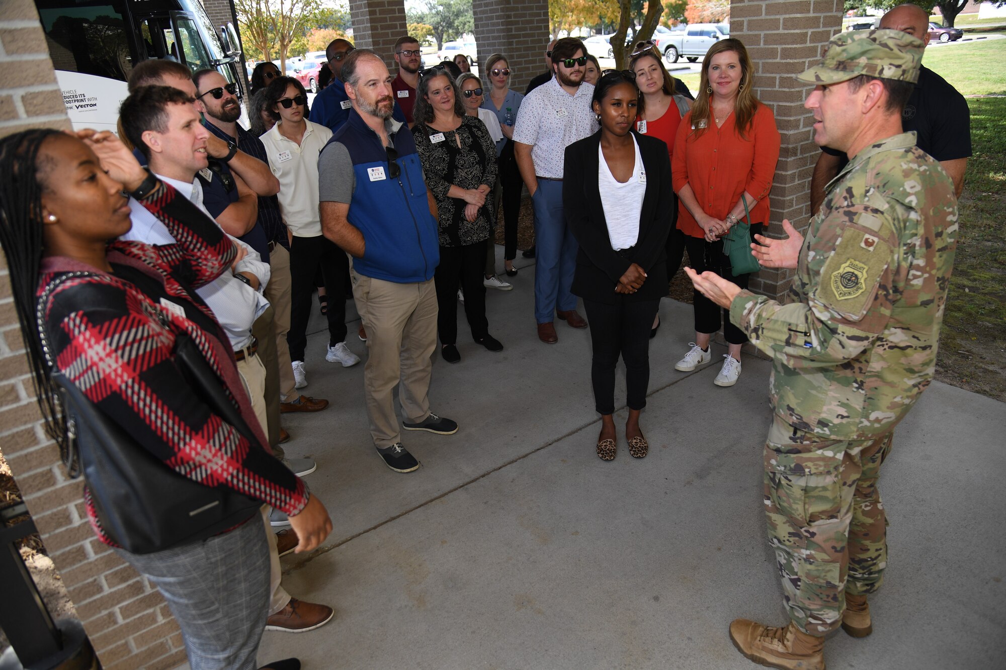 U.S. Air Force Col. Jason Allen, 81st Training Wing vice commander, welcomes members of the Mississippi Gulf Coast Chamber of Commerce Leadership Gulf Coast outside of the Bay Breeze Event Center at Keesler Air Force Base, Mississippi, Nov. 9, 2022.