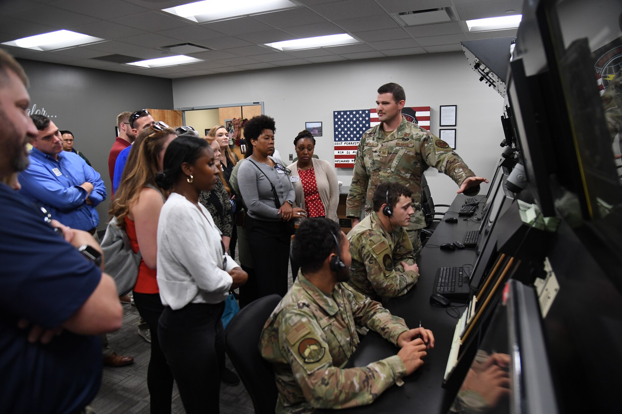 U.S. Air Force Tech. Sgt. Cody Boswell, 334th Training Squadron instructor, briefs members of the Mississippi Gulf Coast Chamber of Commerce Leadership Gulf Coast on the air traffic control training course inside Cody Hall at Keesler Air Force Base, Mississippi, Nov. 9, 2022.
