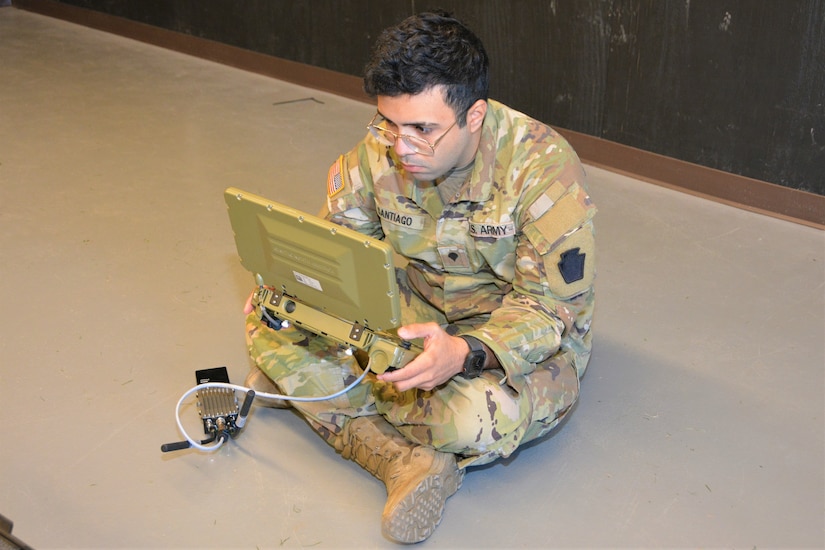 Spc. Antonio Santiago of Bravo Company, 103rd Brigade Engineer Battalion, 56th Stryker Brigade Combat Team uses a controller to remotely operate a Common Robotic System – Individual during training on Nov. 9, 2022, at Fort Indiantown Gap, Pa. The CRS-I is a 32-pound, tracked robot with multiple cameras and an extendable arm that can fit into a medium ruck sack or an assault pack.
