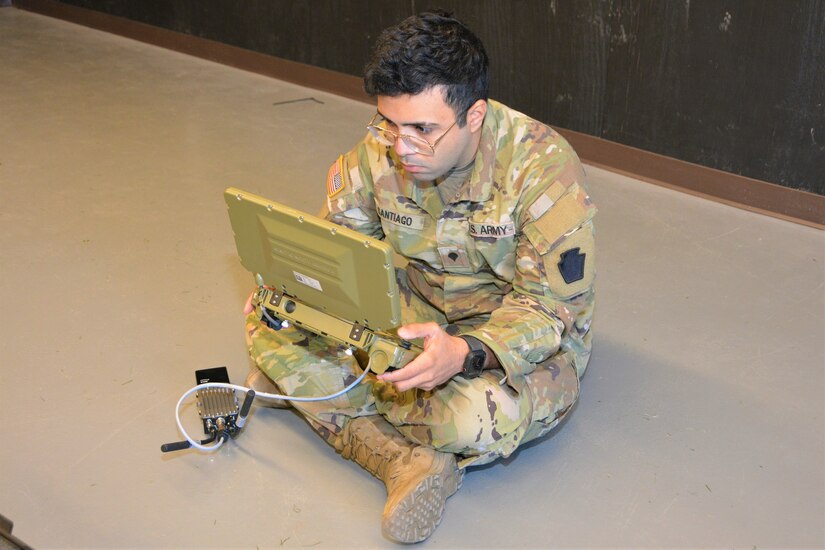 Spc. Antonio Santiago of Bravo Company, 103rd Brigade Engineer Battalion, 56th Stryker Brigade Combat Team uses a controller to remotely operate a Common Robotic System – Individual during training on Nov. 9, 2022, at Fort Indiantown Gap, Pa. The CRS-I is a 32-pound, tracked robot with multiple cameras and an extendable arm that can fit into a medium ruck sack or an assault pack.