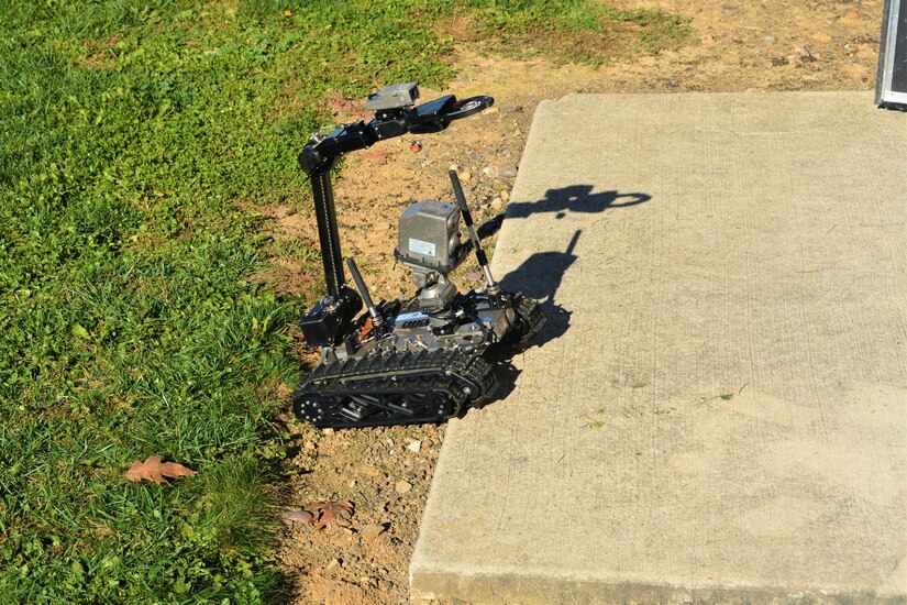 A remotely operated Common Robotic System – Individual negotiates a small step during training on Nov. 9, 2022, at Fort Indiantown Gap, Pa. The CRS-I is a 32-pound, tracked robot with multiple cameras and an extendable arm that can fit into a medium ruck sack or an assault pack.
