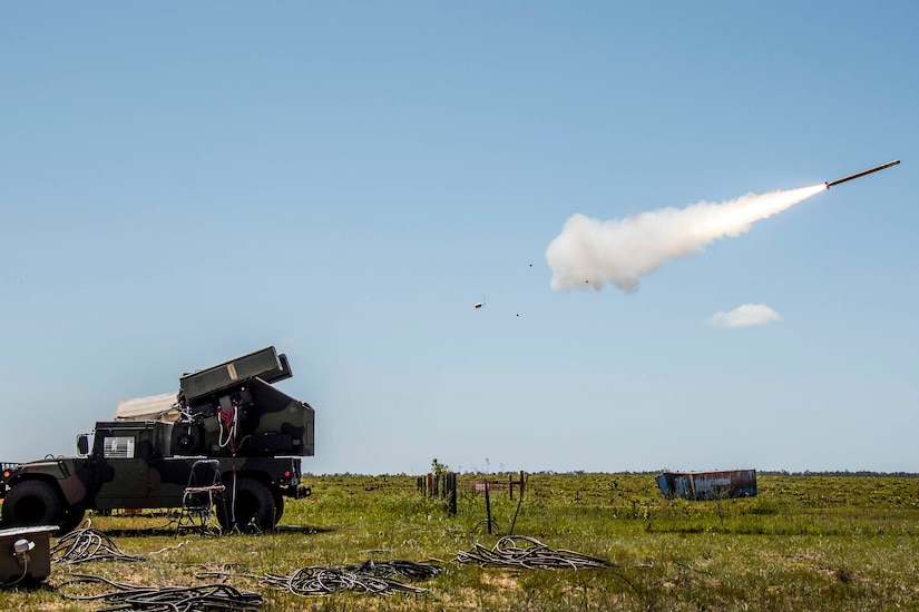 A missile fires from a combat vehicle.