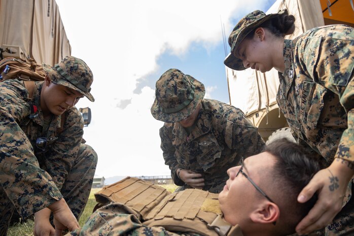 A simulated casualty is treated by Shock Trauma Platoon One, Bravo Surgical Company, 3d Medical Battalion, during an STP and Enroute Care exercise, Landing Zone Boondockers, Marine Corps Base Hawaii, Nov. 1, 2022. The purpose of this training was to assess Bravo Surgical Company’s STP and ERC programs in order to enhance operational readiness. (U.S. Marine Corps photo by Lance Cpl. Cody Purcell)
