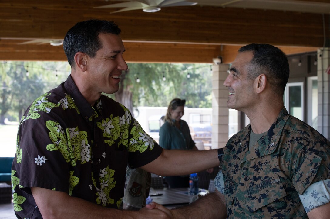 U.S. Marine Corps Col. Speros Koumparakis, right, commanding officer, Marine Corps Base Hawaii, welcomes Congressman Kaiali'i Kahele, U.S. representative, during a visit to Bellows Air Force Station, Hawaii, Nov. 4, 2022. The purpose of the visit was for Kahele to gain a better understanding of Bellows' current use, future use and shared topics of community interest. It was also an opportunity to create an environment for future collaboration, transparency and focused topic discussions. (U.S. Marine Corps photo by Cpl. Israel Ballaro)
