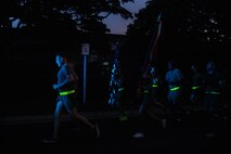 U.S. service members with Headquarters Battalion, Marine Corps Base Hawaii, run in formation during a motivational run, MCBH, Nov. 3, 2022. The purpose of the run was to enhance unit morale, increase physical and mental fitness, and to commemorate the 247th Marine Corps Birthday. (U.S. Marine Corps photo by Lance Cpl. Terry Stennett III)