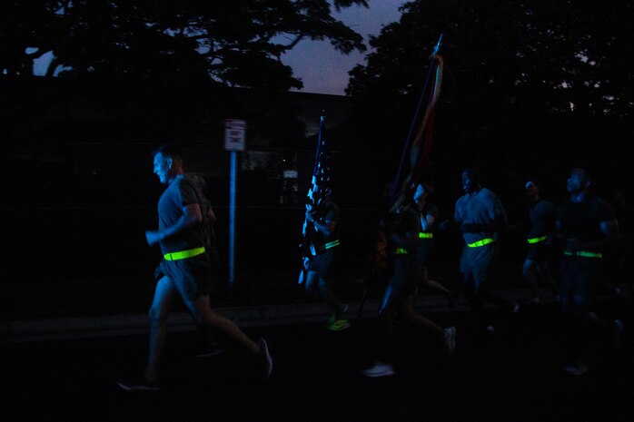 U.S. service members with Headquarters Battalion, Marine Corps Base Hawaii, run in formation during a motivational run, MCBH, Nov. 3, 2022. The purpose of the run was to enhance unit morale, increase physical and mental fitness, and to commemorate the 247th Marine Corps Birthday. (U.S. Marine Corps photo by Lance Cpl. Terry Stennett III)