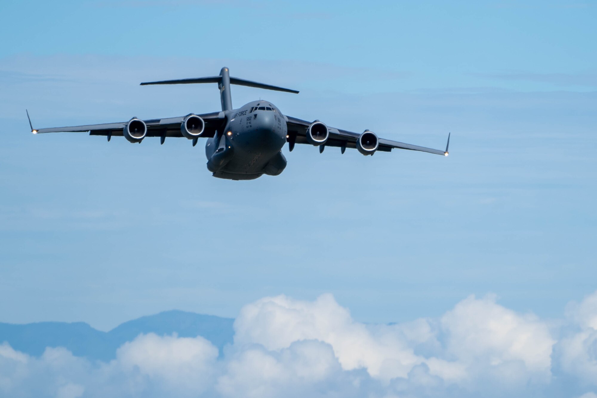 U.S. Air Force C-17 Globemaster III flies in formation during an aerial maneuver training mission around the Hawaiian islands as part of Joint Pacific Multinational Readiness Center (JPMRC) exercise 23-01, Nov. 5, 2022. JPMRC is a regional combat training center rotation that strengthens relationships and increases interoperability to help ensure a free and open Indo-Pacific. (U.S. Air Force photo by Senior Airman Makensie Cooper)