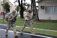 Sgt. Nhien Nguyen, left, assigned to the 35th Combat Sustainment Support Battalion, and 35th CSSB Command Sgt. Maj. Paul Denson, right, conduct a ruck march event together during the unit’s second annual “Best Warrior” competition Oct. 14 on Sagami General Depot, Japan.