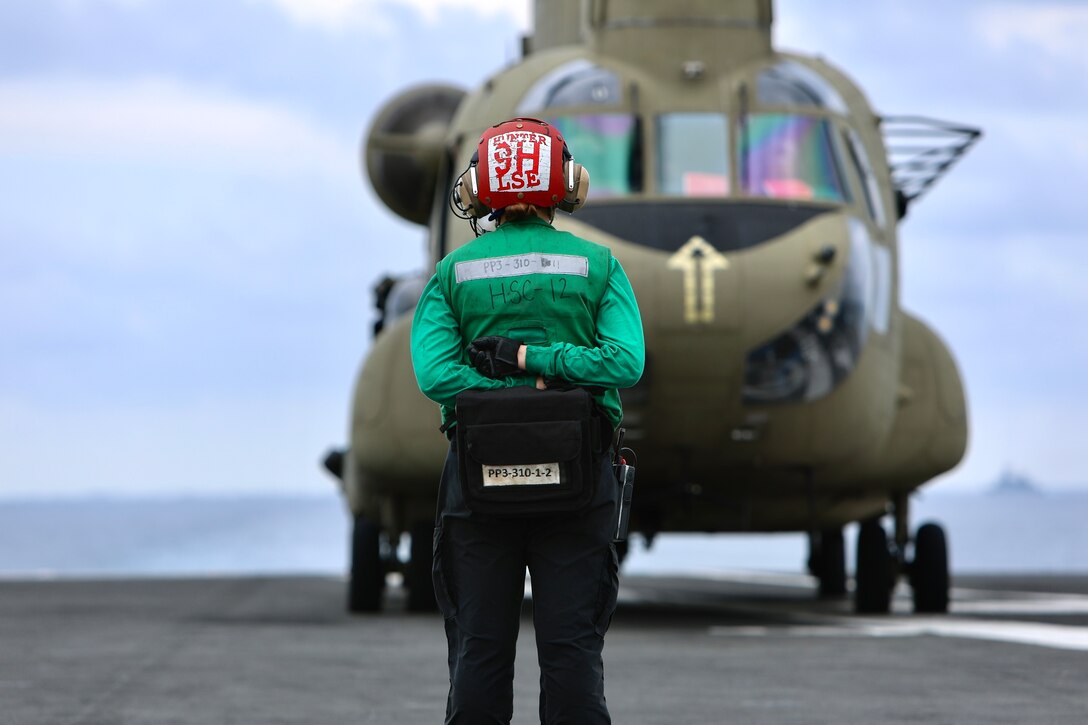 Soldiers from B Company, 3-2 General Support Aviation Battalion, 2nd Combat Aviation Brigade conducted deck landings with CH-47F Chinook helicopters on the the U.S. Navy's only forward-deployed aircraft carrier, USS Ronald Reagan (CVN 76), in the waters east of the Korean peninsula on September 26, 2022. Deck landing qualifications are conducted to certify air crew members and pilots on landing on a ship. This training was conducted in part with the Maritime Counter Special Operations Exercise (MCSOFEX) to strengthen interoperability with our joint partners.