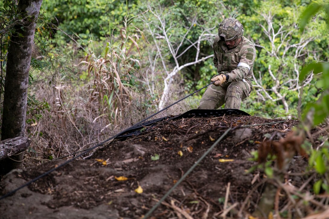 A Soldier from the New Zealand Army goes over the cliff face during rappel instruction at Exercise Cartwheel, Nadi, Fiji, September 18, 2022. Exercise Cartwheel is a multilateral military-to-military training exercise with the United States, Republic of Fiji Military, Australian, New Zealand, and British forces that builds expeditionary readiness and interoperability by increasing the capacity to face a crisis and contingencies by developing and stressing units at the highest training levels.