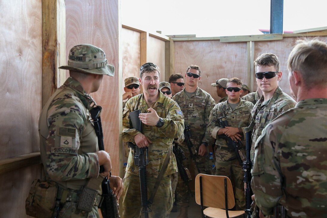 Australian Cpl. Louis Carbery, an infantry soldier of the 8/9th battalion royal Australian regiment, shows how his army clears hallways and intersections in a shoot house, in Fiji, September 13, 2022. Exercise Cartwheel is a multilateral military-to-military training exercise with the United States, Republic of Fiji Military, Australian, New Zealand, and British forces that builds expeditionary readiness and interoperability by increasing the capacity to face a crisis and contingencies by developing and stressing units at the highest training levels.